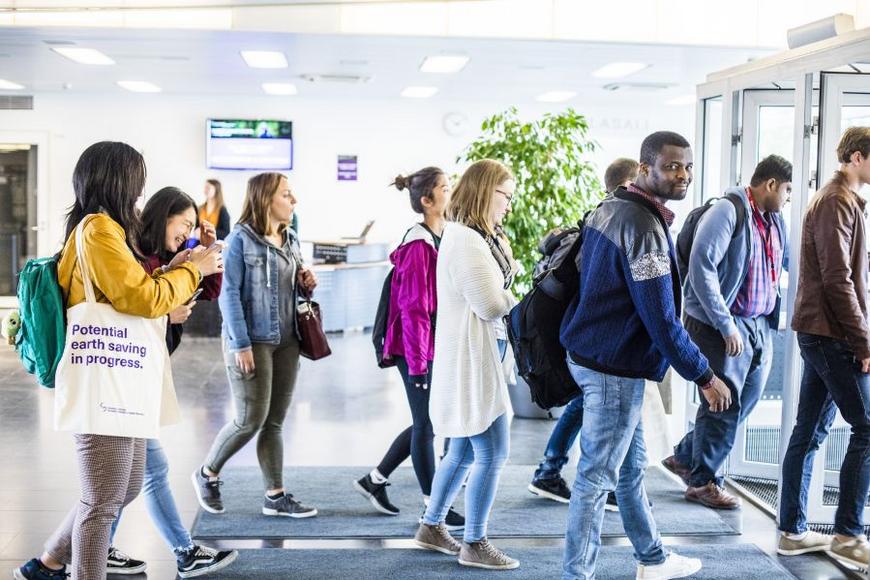 Students walking in the lobby.