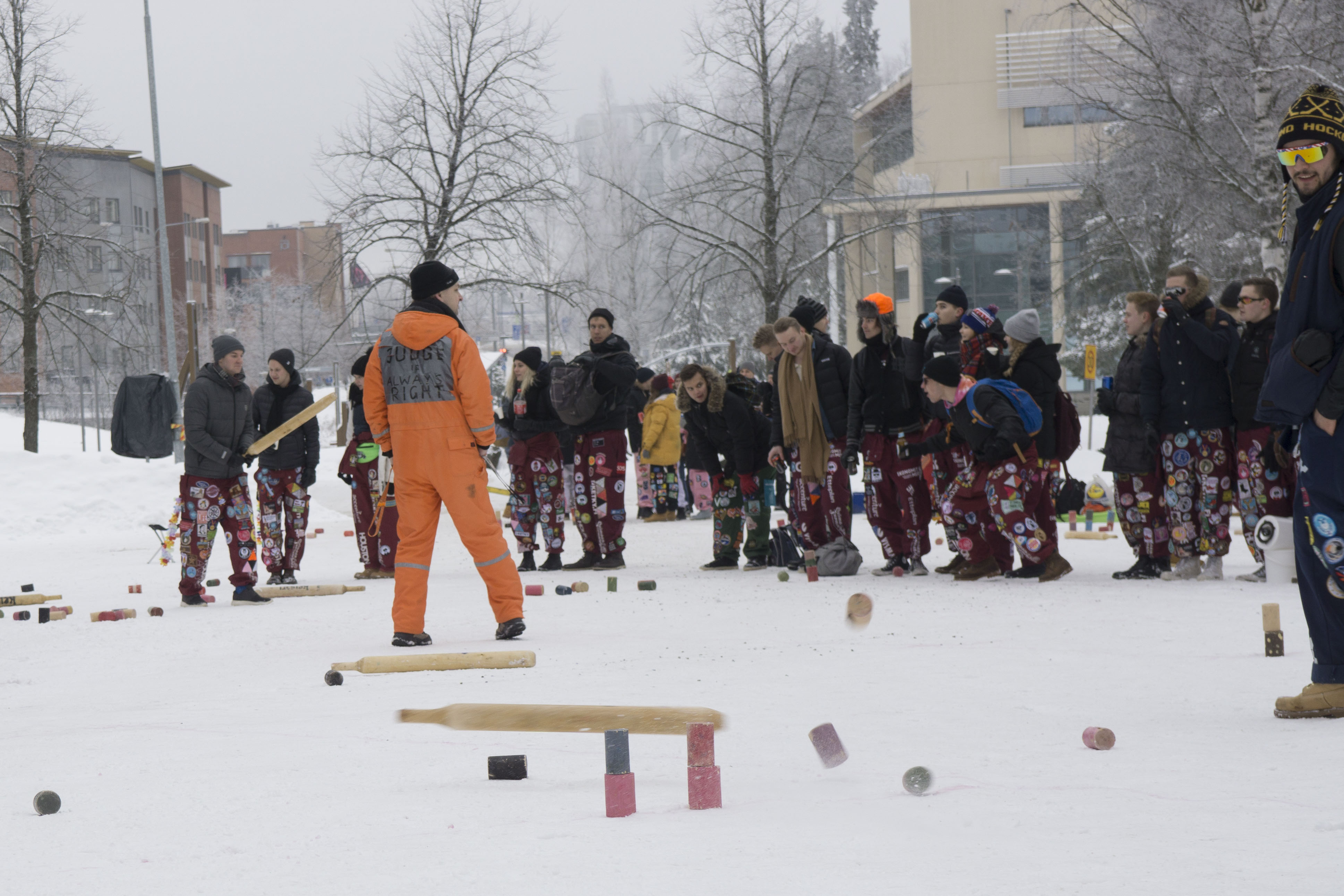 Students playing kyykkä.