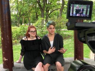 two youngsters talking to a camera