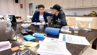 Young men working together on a computer