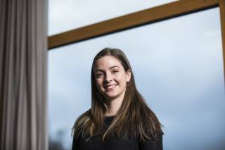 Photo of the subject Elia with curtains in the background