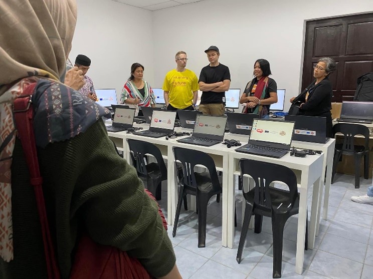 People standing in a classroom.