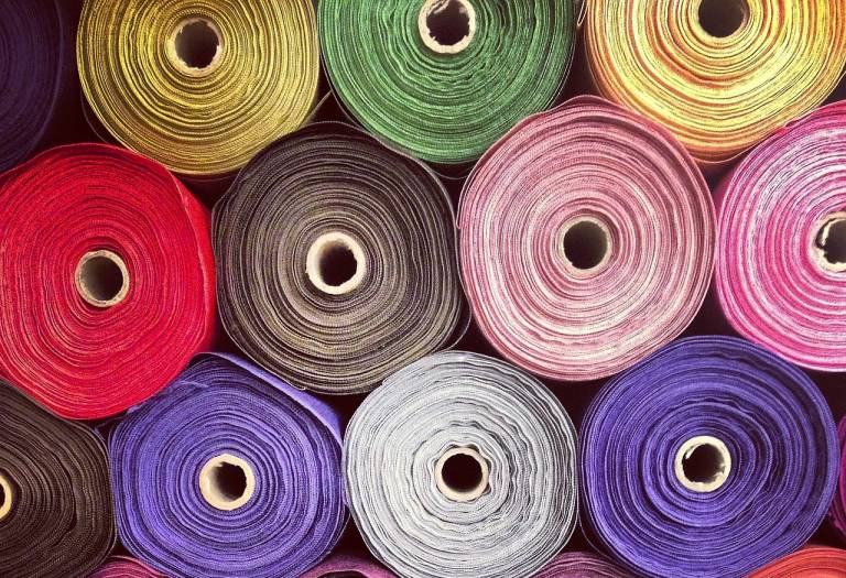 Fabric rolls in different colors.