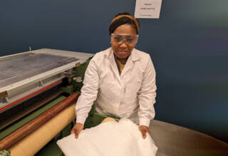 A young lady in a textile lab.