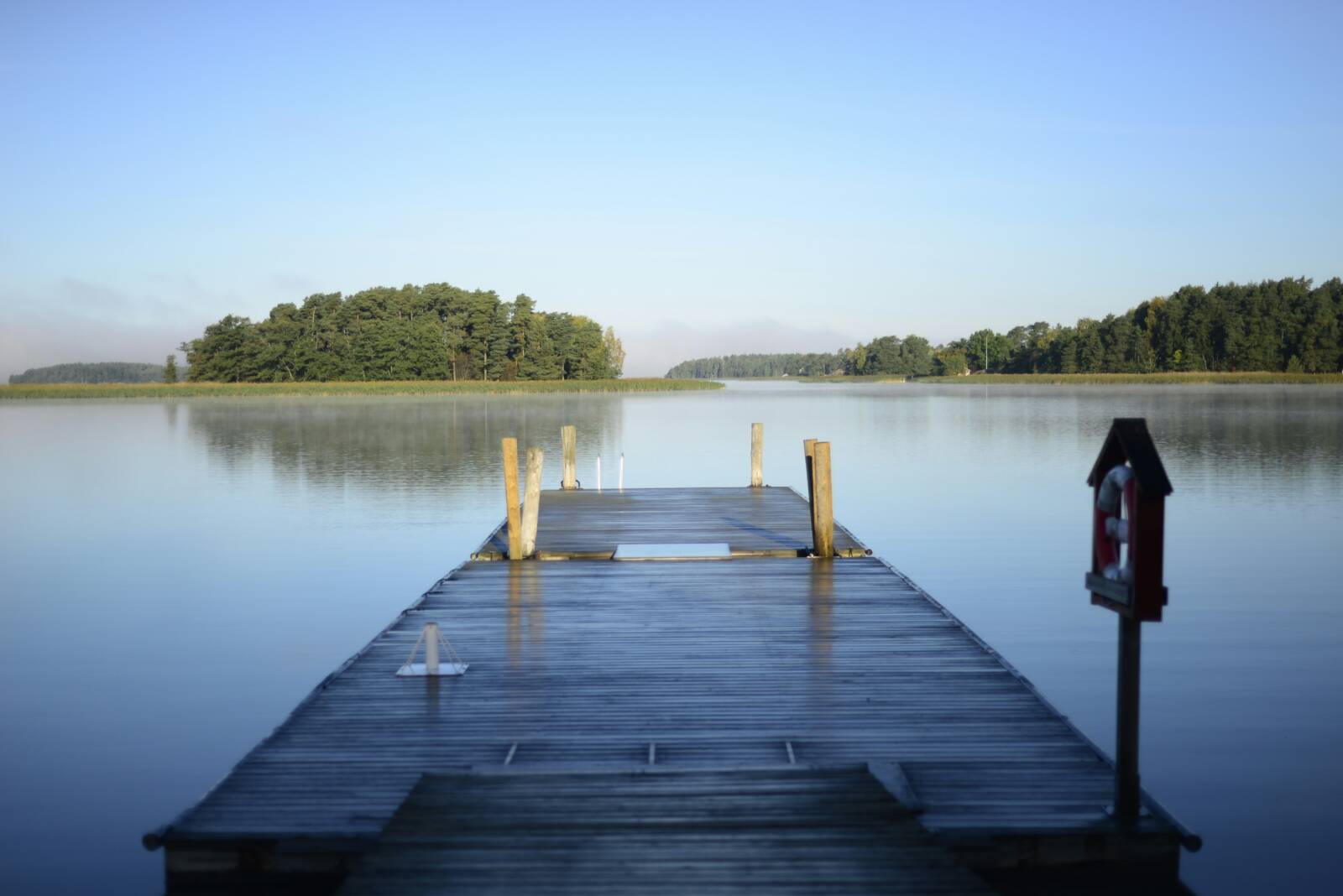 Image of a lakeside view from a pier